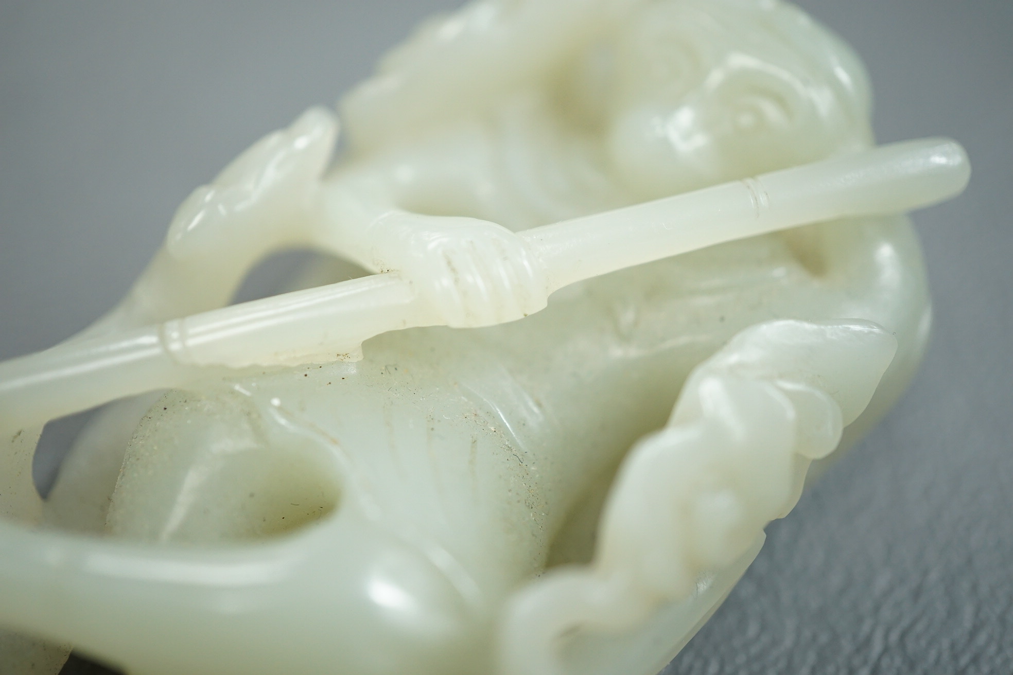 A Chinese pale celadon jade carving of Sun Wukong, the Monkey King, 18th/19th century